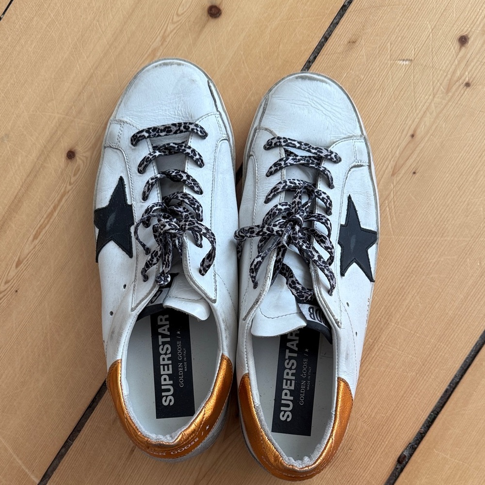 Golden Goose White and Black Sneakers with Gold Accents